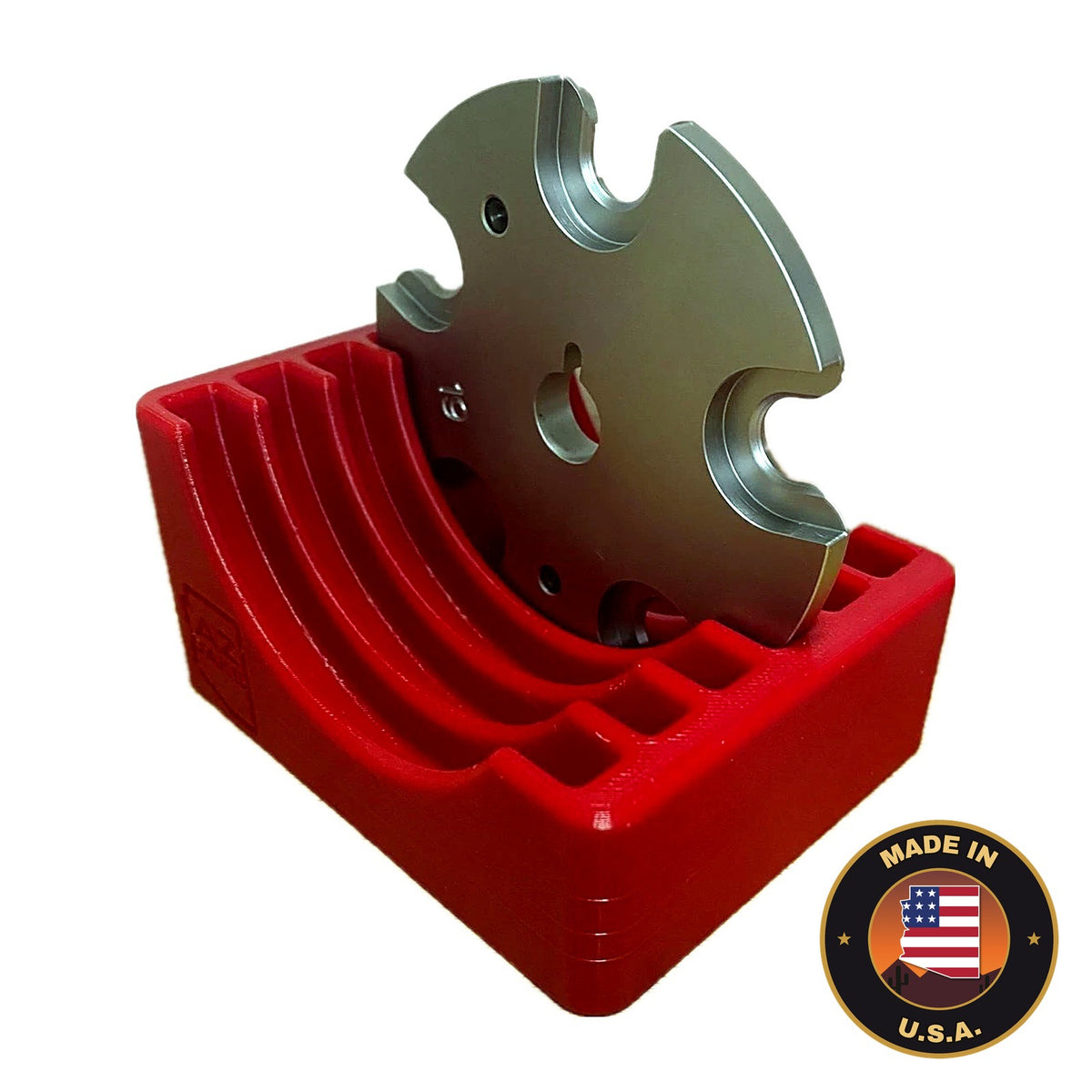 Red benchtop rack holding a Hornady Lock-N-Load shell plate, Made in USA badge