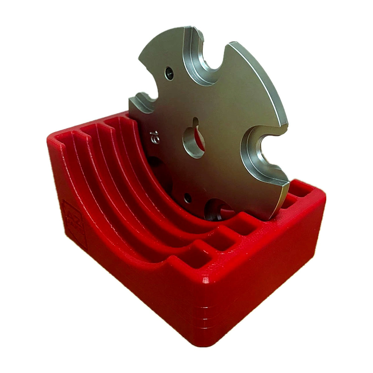 Red benchtop rack with a Hornady LNL shell plate in the front slot