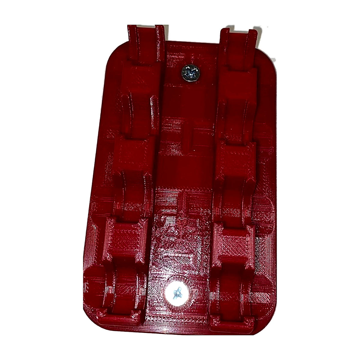 Empty red shell holder rack showing the mounting holes
