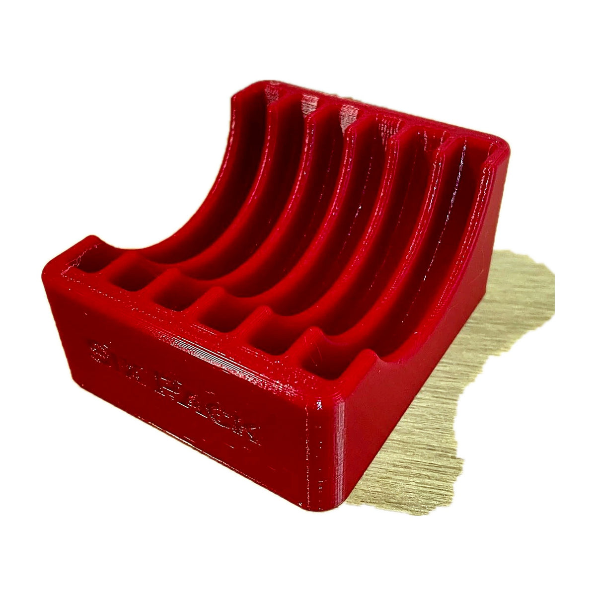 Empty red benchtop shell plate rack, angled view