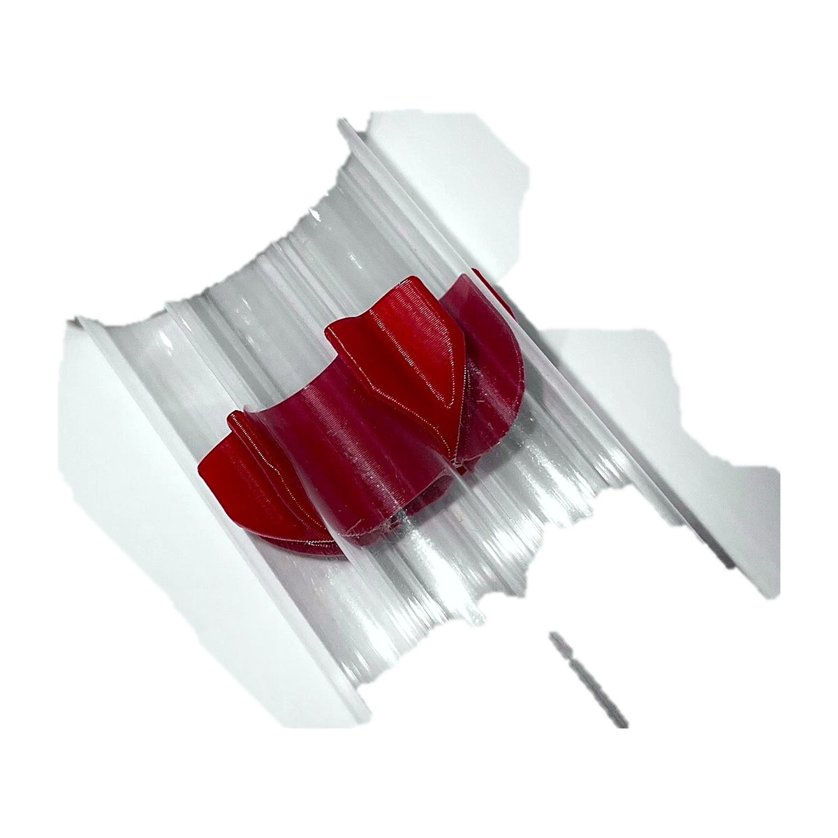 Red support clamp holding a bundle of 5 clear case feed tubes, side view