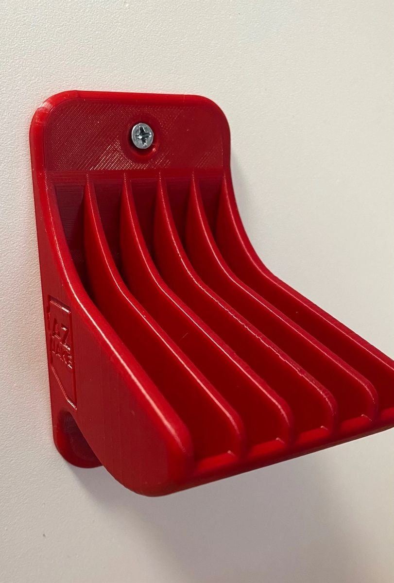 Empty red wall-mount shell plate rack, angled view